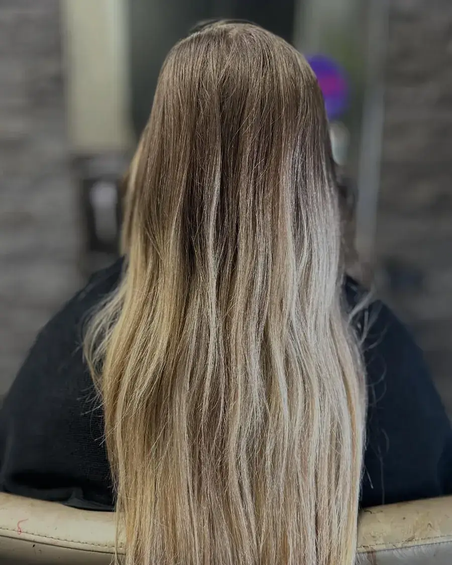 Blond lumineux avec racines fondues sur cheveux longs — coiffeur à Calais